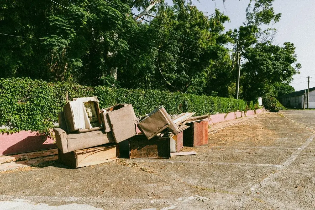 old furniture loaded on a junk removal truck