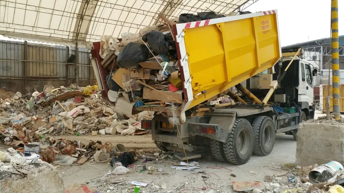 a loaded junk truck after a garage cleanout